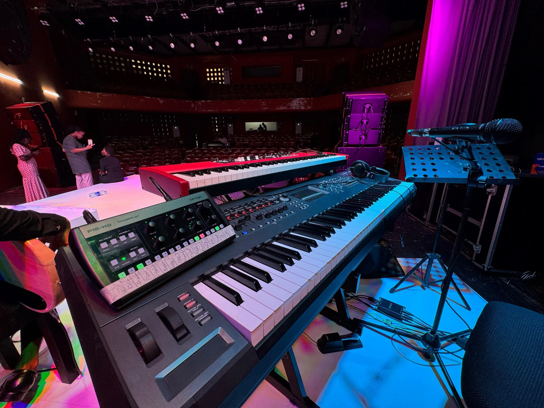 Professional keyboards and sound equipment on a stage